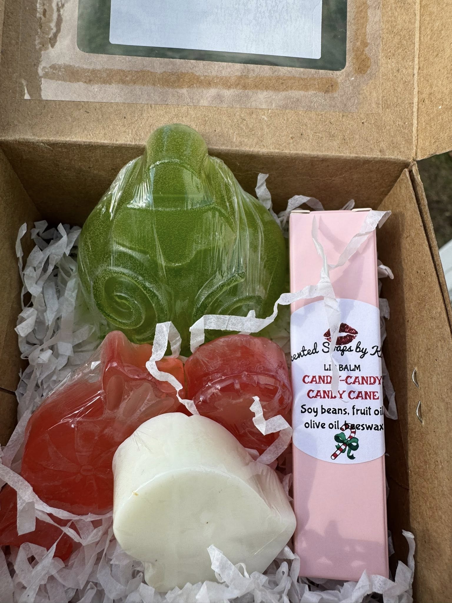 SANTA'S GOT A NEW STOP! Gift Set includes: 1 candy cane lip balm. 2 candy cane soaps. 1 mitten soap. 1 large Dickens Christmas Ornament