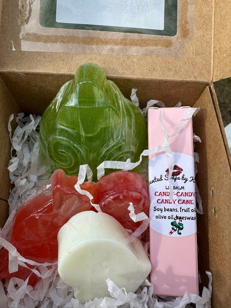 SANTA'S GOT A NEW STOP! Gift Set includes: 1 candy cane lip balm. 2 candy cane soaps. 1 mitten soap. 1 large Dickens Christmas Ornament