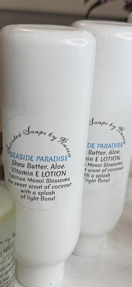 Seaside Paradise Lotion. Shea Butter, Aloe, Monoi blossoms, the sweet scent of coconut. Slightly floral.