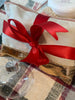 Peach Lotion. Matching Soap. Sisal bag for easy exfoliating. All items are included in a zipped bag wrapped with ribbon.