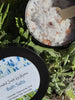 Bath Sea Salts. Lavender and Chamomile. Pink Himalayan salt. Black jars with wooden spoons.