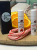 Lip Balm. 2 to a package. Candy Cane. Freshly squeezed Orange. Black box with sticker.