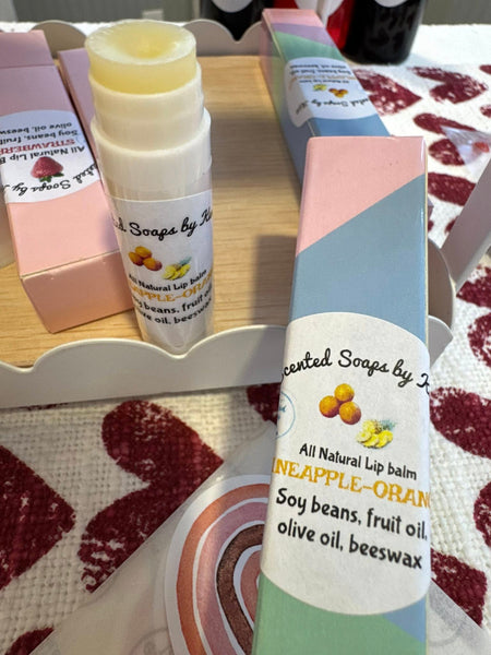 Pineapple and Tangerine Lip Balm. Pink boxes. Apple fruit, soy fruit, local beeswax. Colorful boxes.