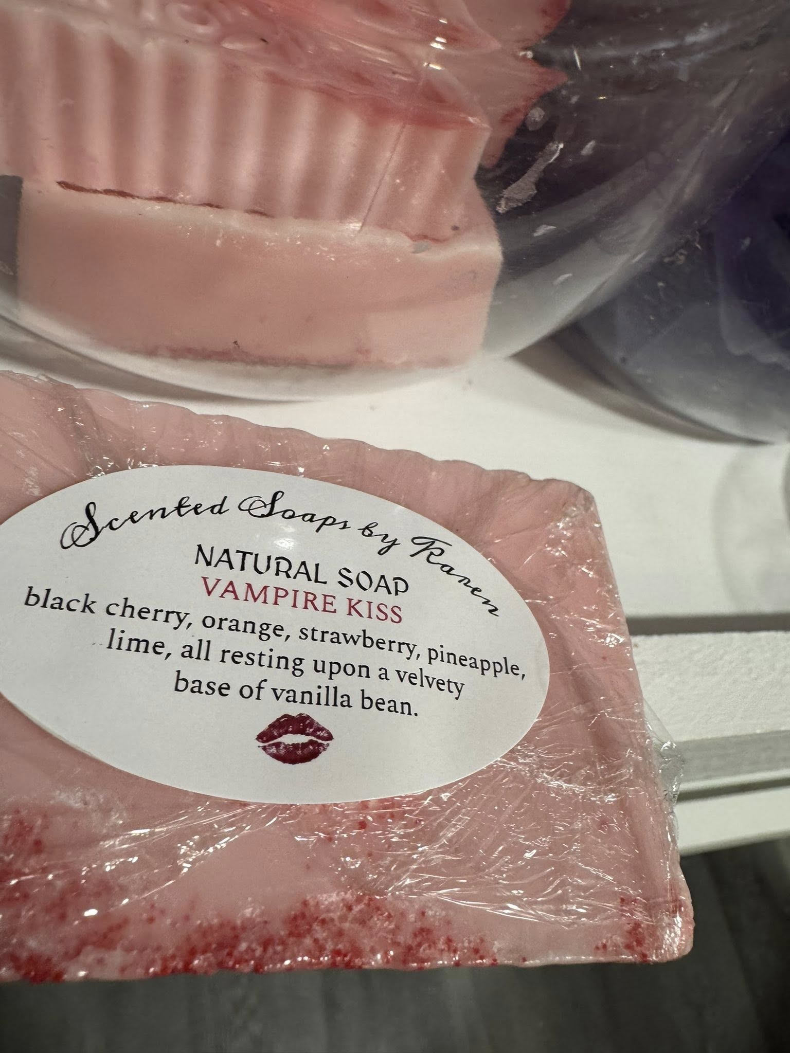 VAMPIRE KISS SOAP. Black cherry, orange, strawberry, pineapple, lime, resting on velvety base of vanilla bean.