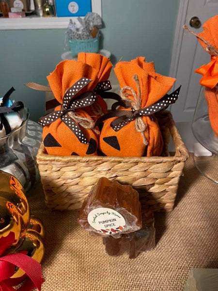 Pumpkin Spice leaves. Two olive oil and glycerin maple leaves.   Tucked into a burlap bag and finished with brown and white polka dot ribbon